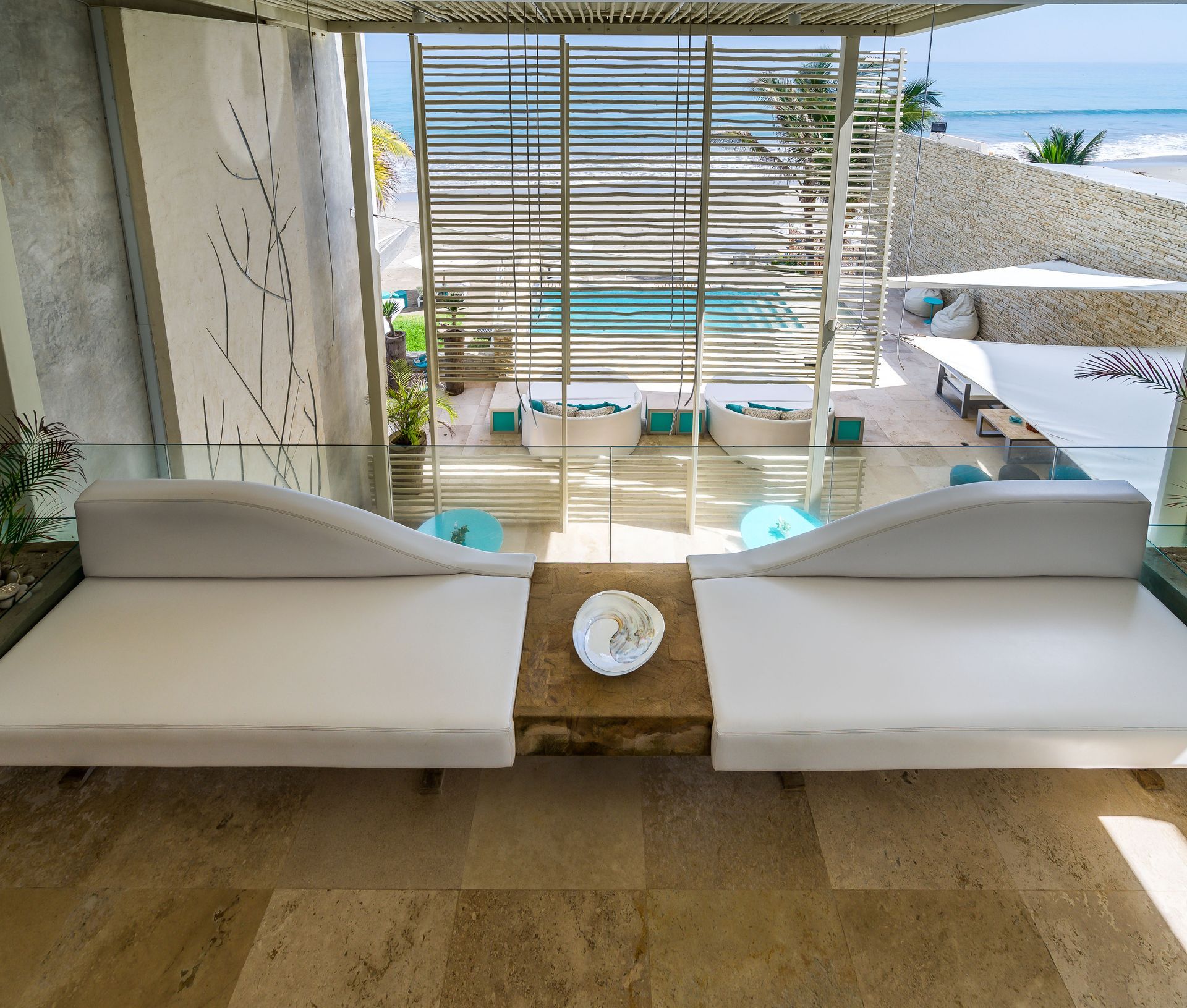 A living room with a couch and a table with a bowl on it