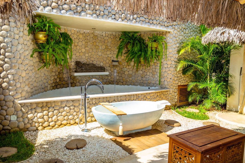 There is a bathtub in the middle of the garden.