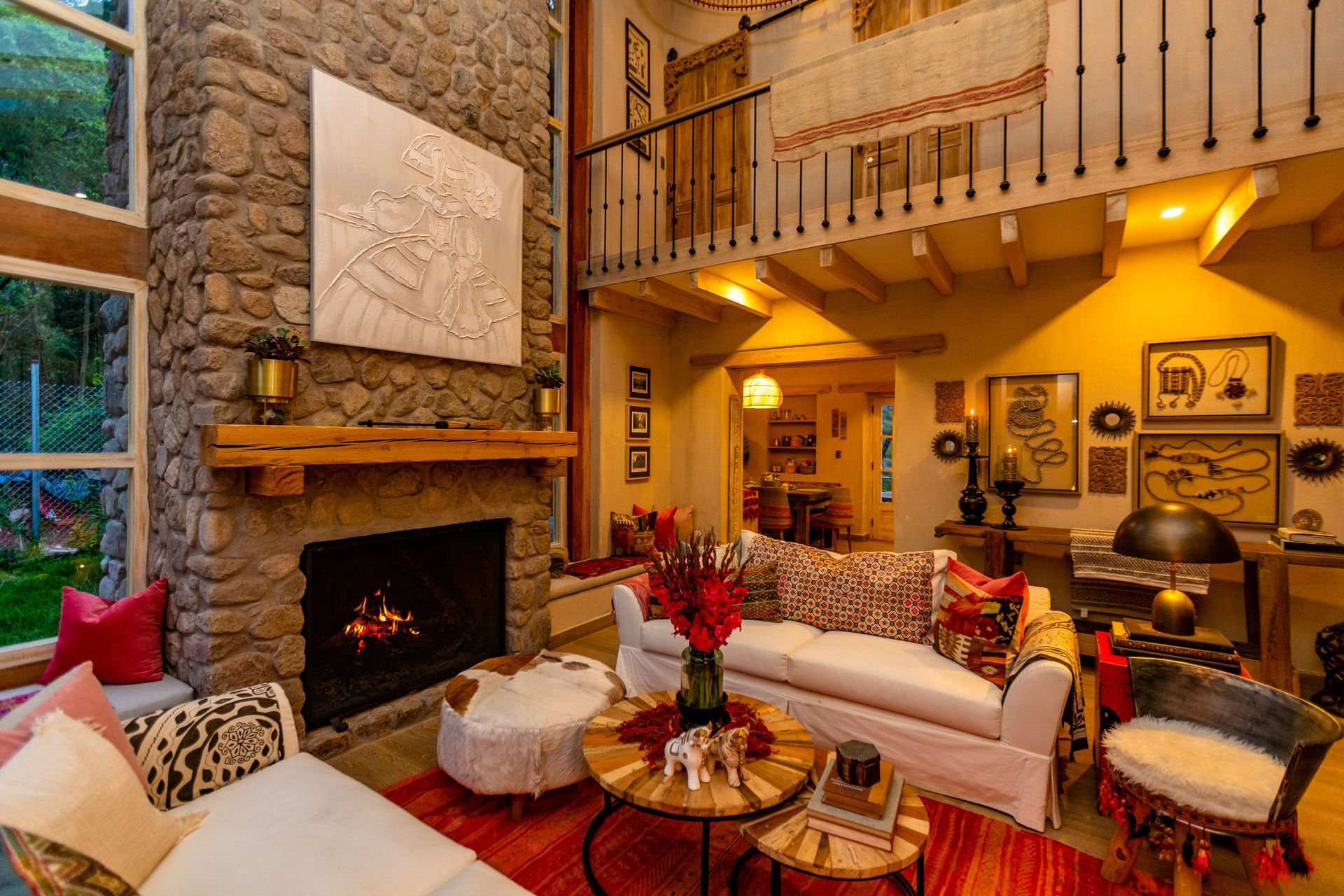 There is a fireplace in the middle of the living room.