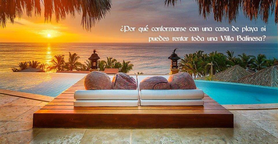 A couple of beds sitting on top of a wooden deck next to a swimming pool.