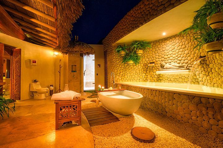A bathroom with a bathtub and a toilet.