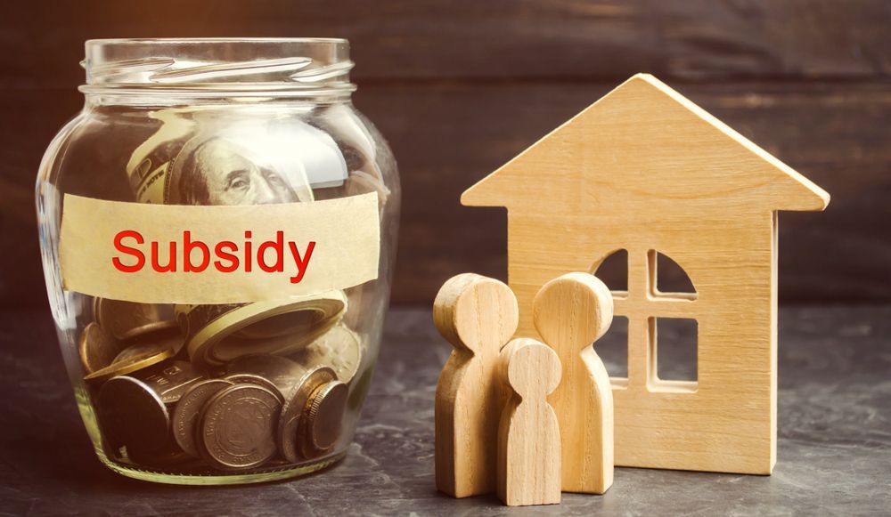 Jar Labeled With House — Midcoast Financial Planning Group in Tuncurry, NSW