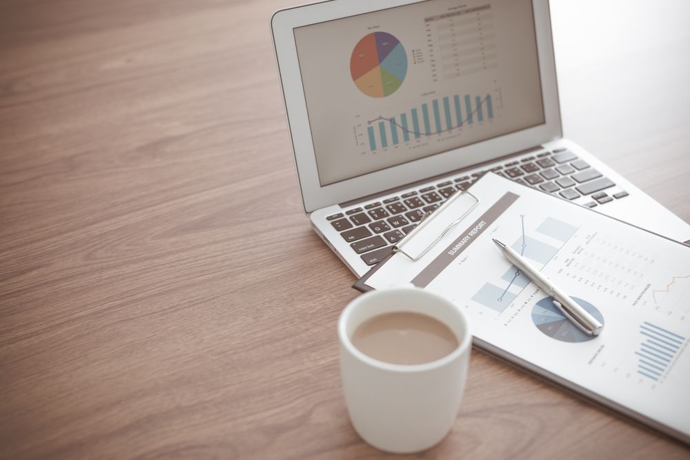 Laptop Displaying Charts, Papers — Midcoast Financial Planning Group in Tuncurry, NSW