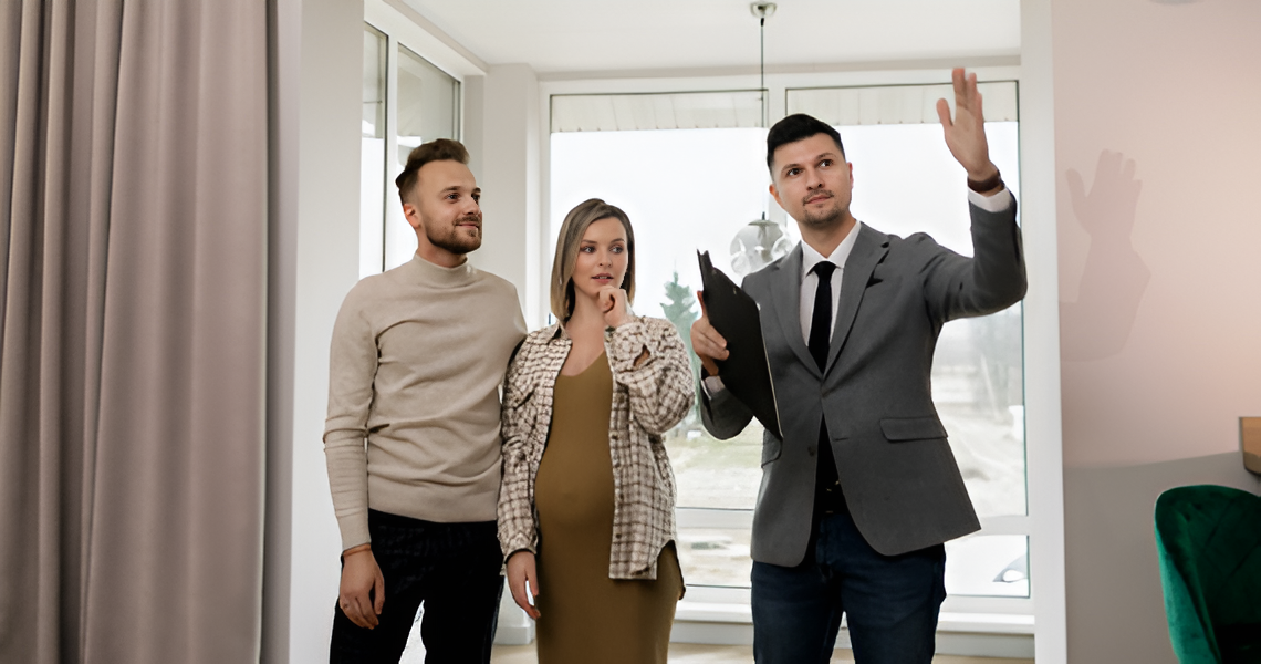 Real Estate Agent Showing a Couple — Midcoast Financial Planning Group in Tuncurry, NSW