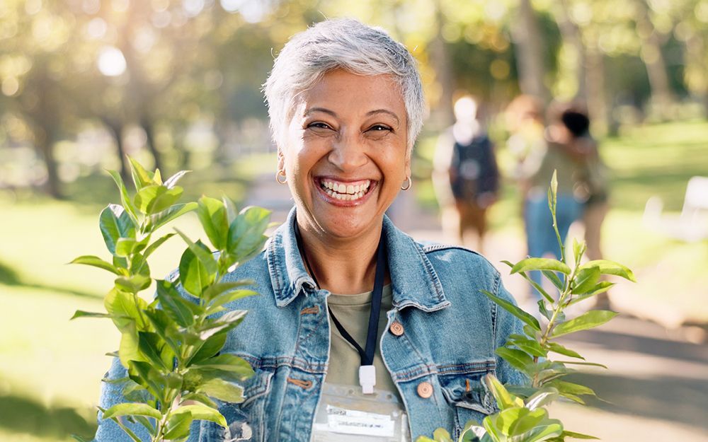 A Woman Smiling — Midcoast Financial Planning Group in Tuncurry, NSW
