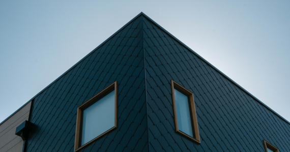 Blue Triangular Building Corner With Two Windows — Midcoast Financial Planning Group in Tuncurry, NSW