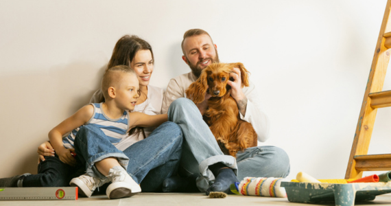Family With Dog Sitting Near A Wall — Midcoast Financial Planning Group in Tuncurry, NSW