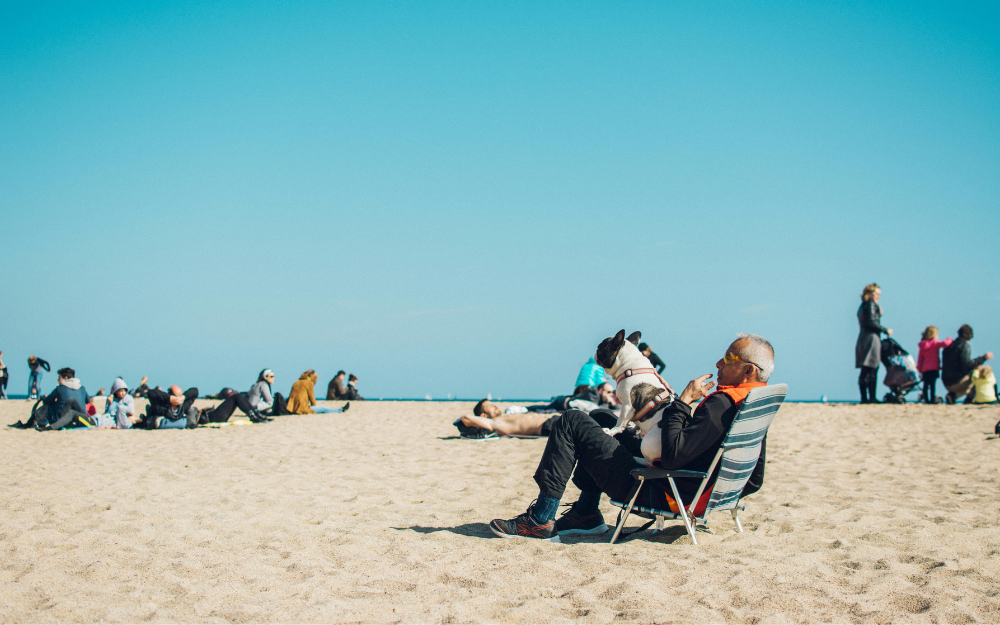 Man in A Chair on A Beach — Midcoast Financial Planning Group in Tuncurry, NSW
