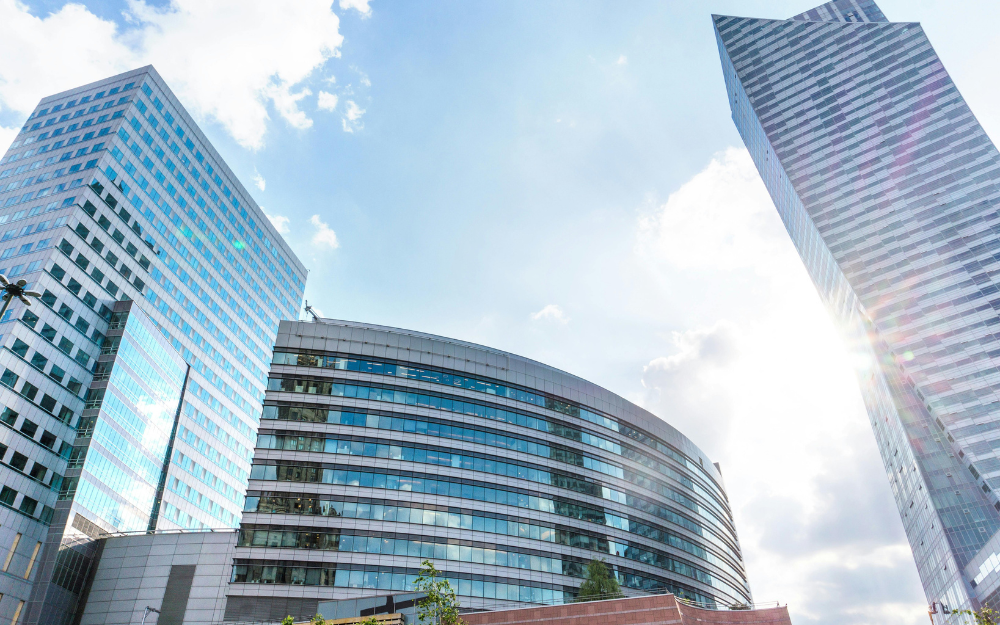 Skyscrapers Against a Bright Blue Sky — Midcoast Financial Planning Group in Tuncurry, NSW