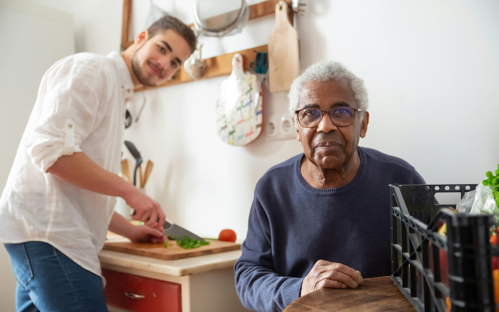 A Young Man Cutting Vegetables — Midcoast Financial Planning Group in Tuncurry, NSW