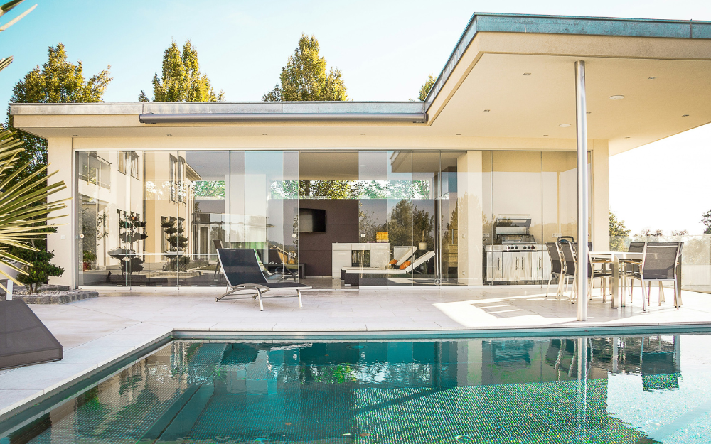 Poolside Patio with Modern House — Midcoast Financial Planning Group in Tuncurry, NSW