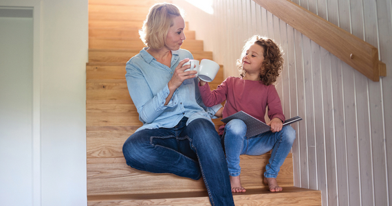 Woman and Child Sitting — Midcoast Financial Planning Group in Tuncurry, NSW