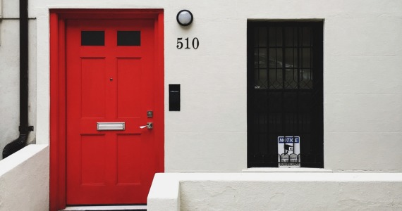 Red Door with Black Window, White Building — Midcoast Financial Planning Group in Tuncurry, NSW