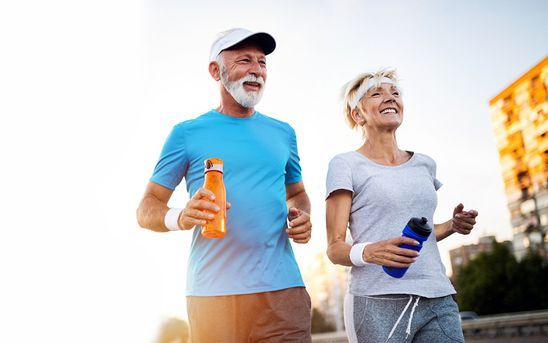 Elderly Couple Jogging Outdoors — Midcoast Financial Planning Group in Tuncurry, NSW