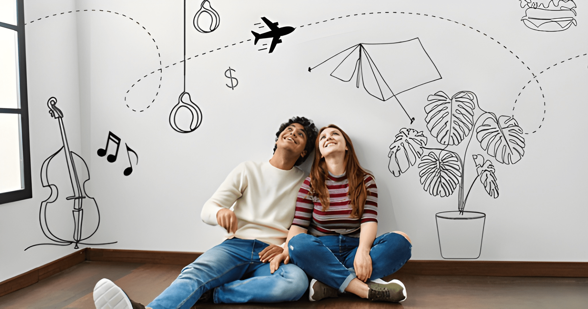 Couple Sitting on Floor Looking Up at Drawings on a White Wall, Includes Travel and Music Themes — Midcoast Financial Planning Group in Tuncurry, NSW