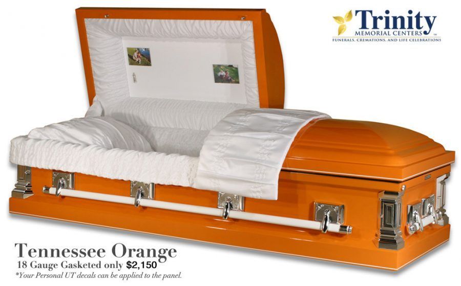 An orange coffin with the word trinity on it