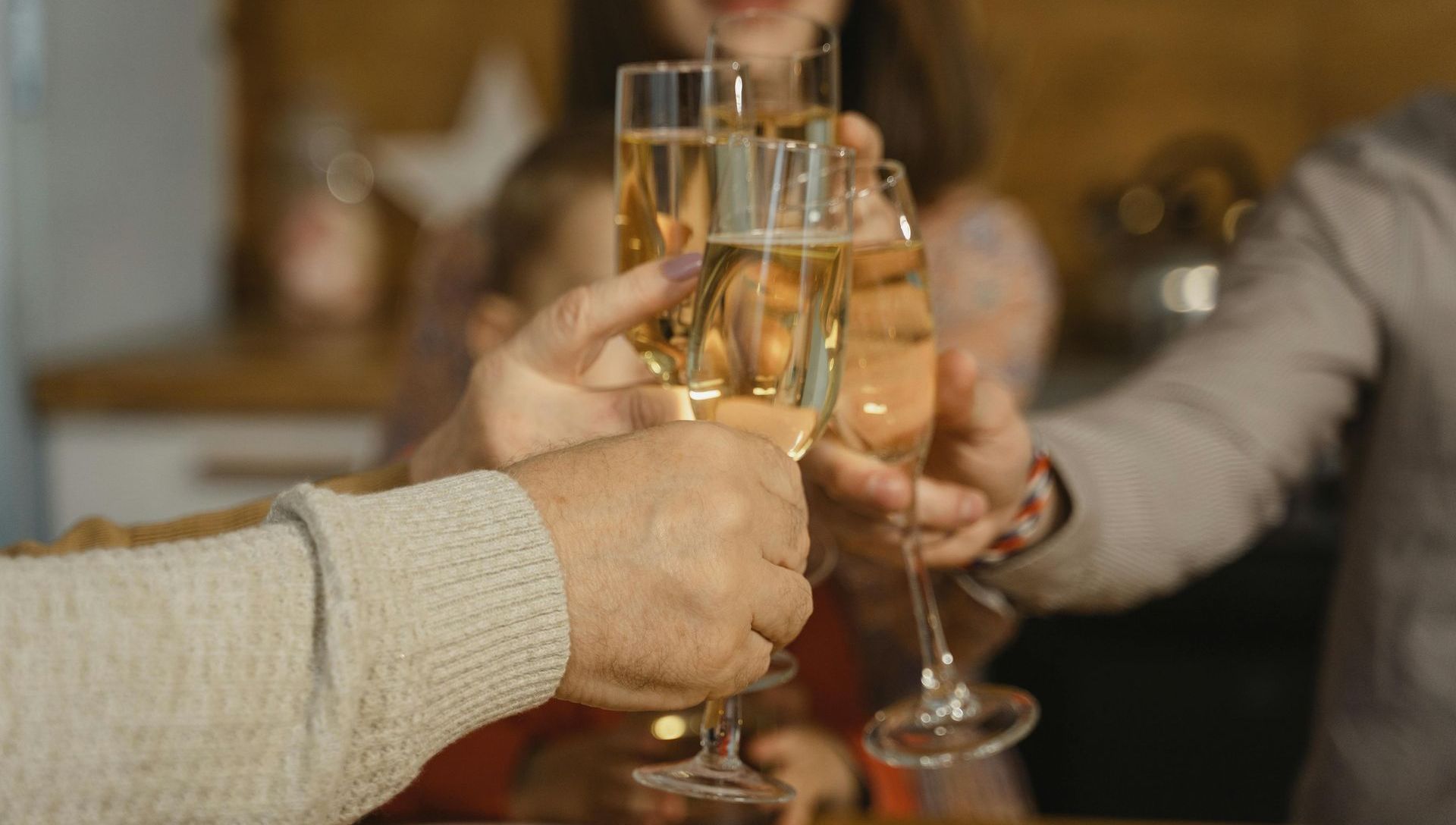 A group of people are toasting with champagne glasses.