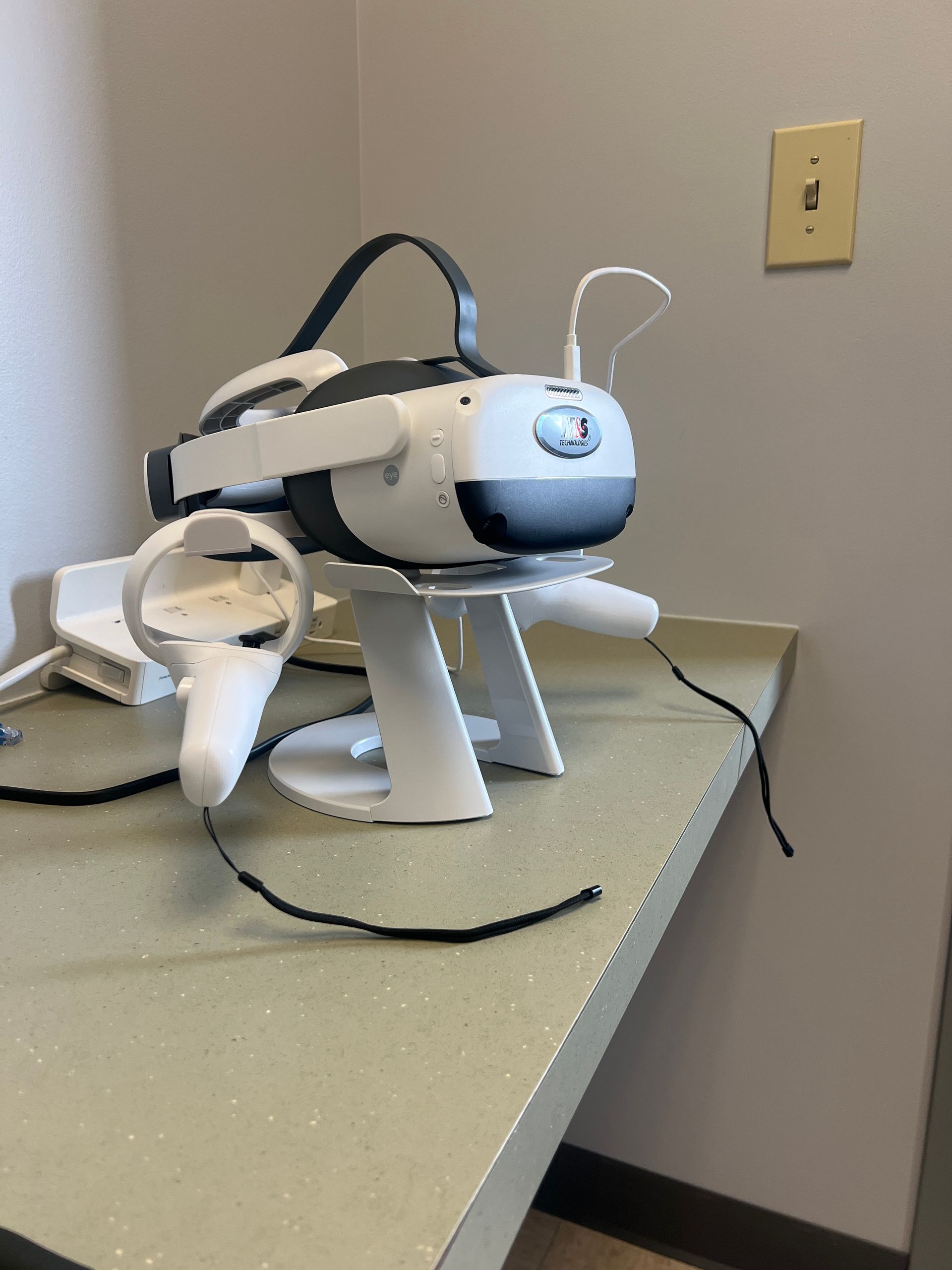 A virtual reality headset and controllers are sitting on a table | Intrepid Research