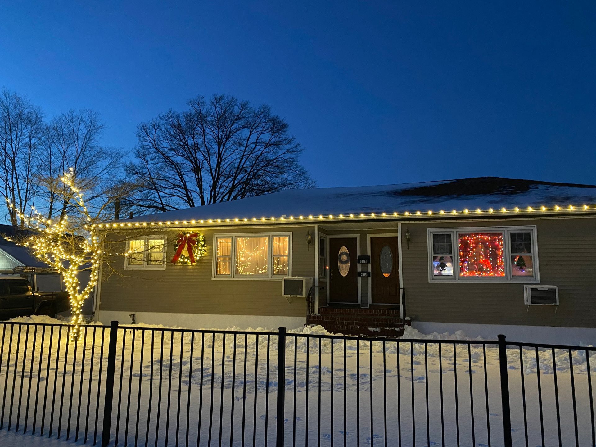 House with expert holiday light installation