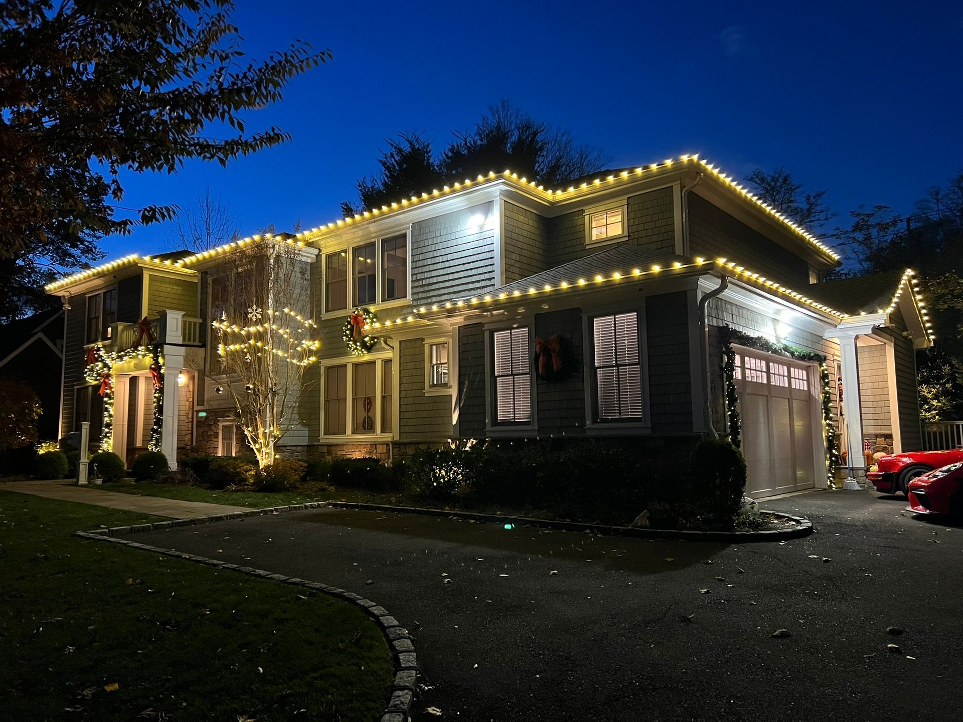 Two-story home lit up for the holiday season