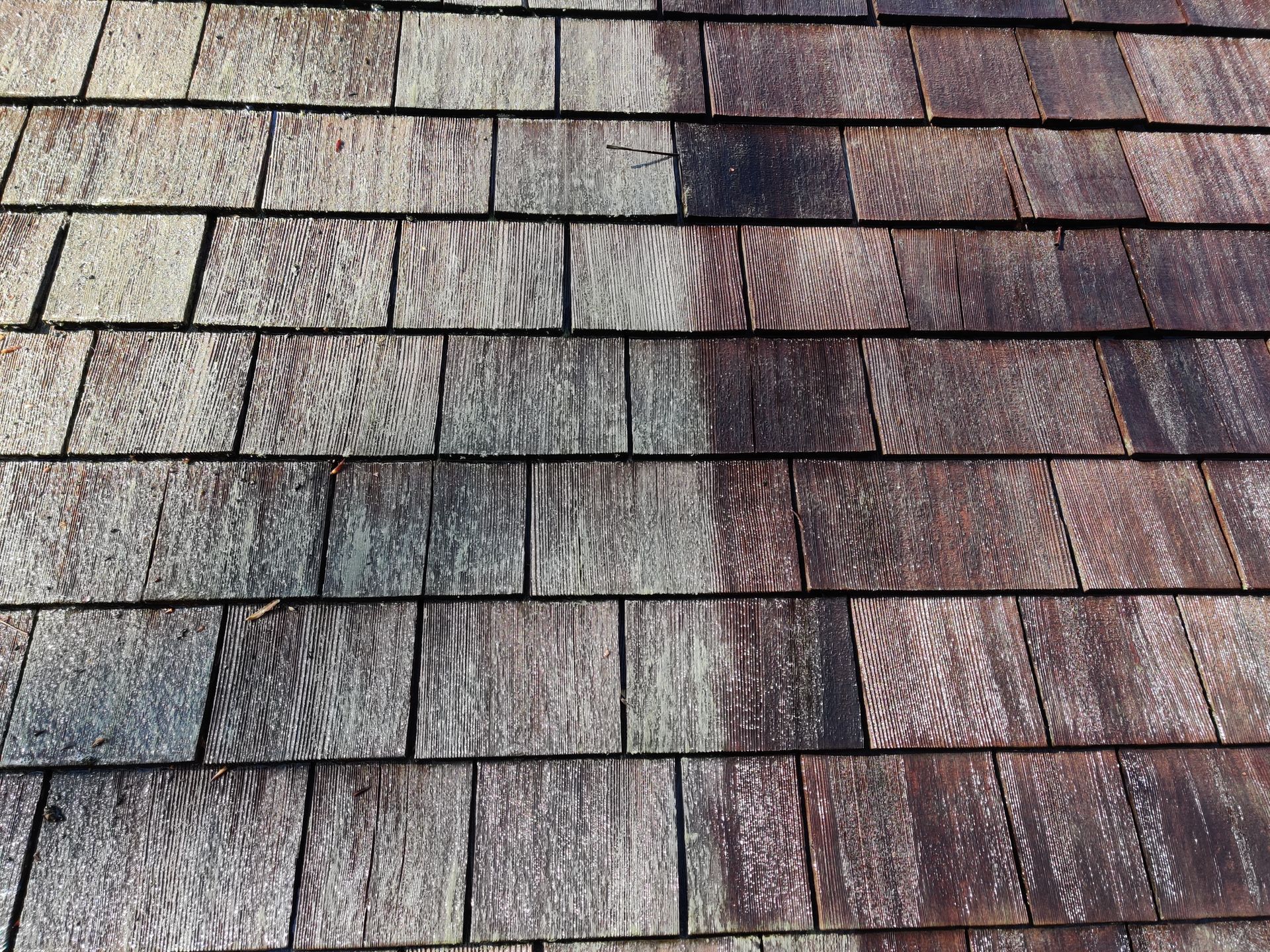 A roof before and after power washing