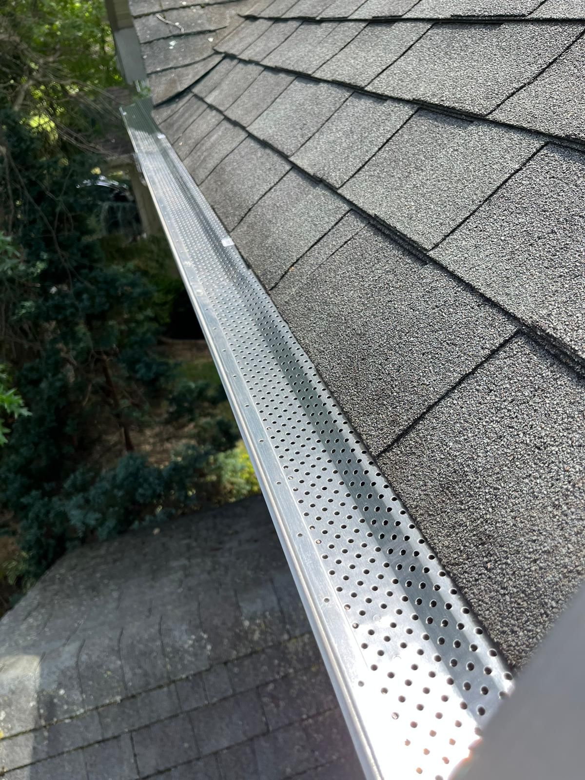Professional gutter guard installation on a home