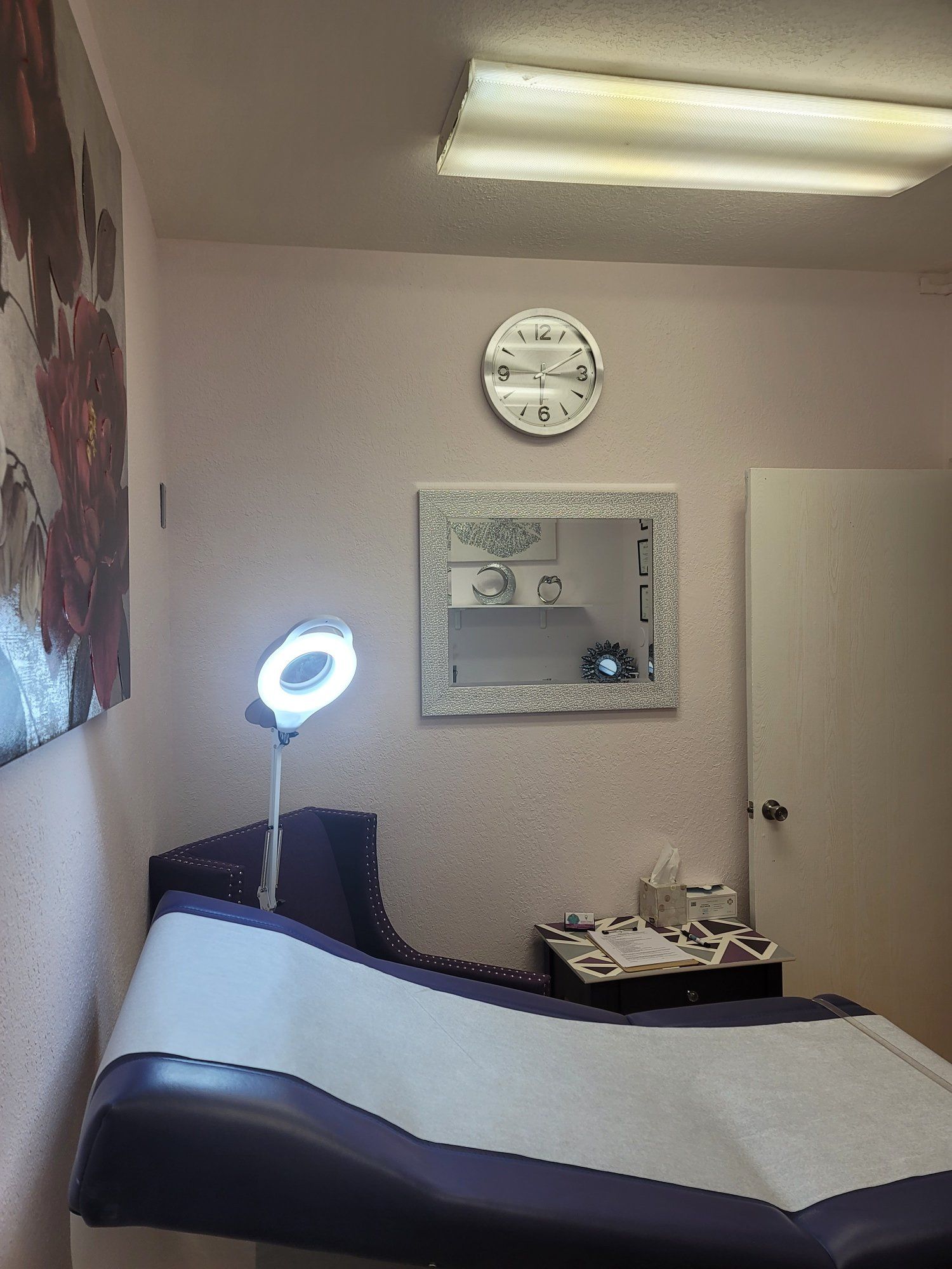 A room with a bed and a mirror on the wall