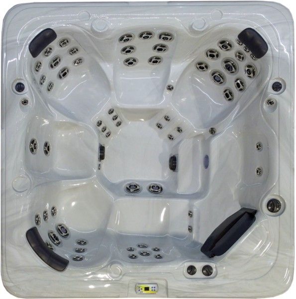 Top-down view of a white, square hot tub with multiple jet seats and headrests.
