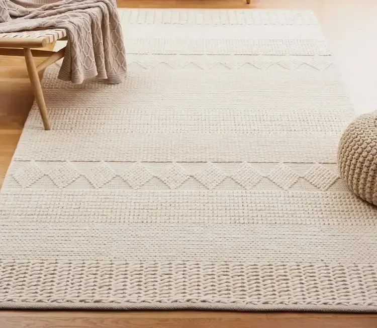 A glass of red wine spilled on a white surface