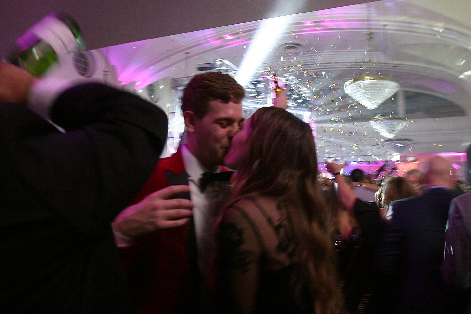 Couple kissing at the party