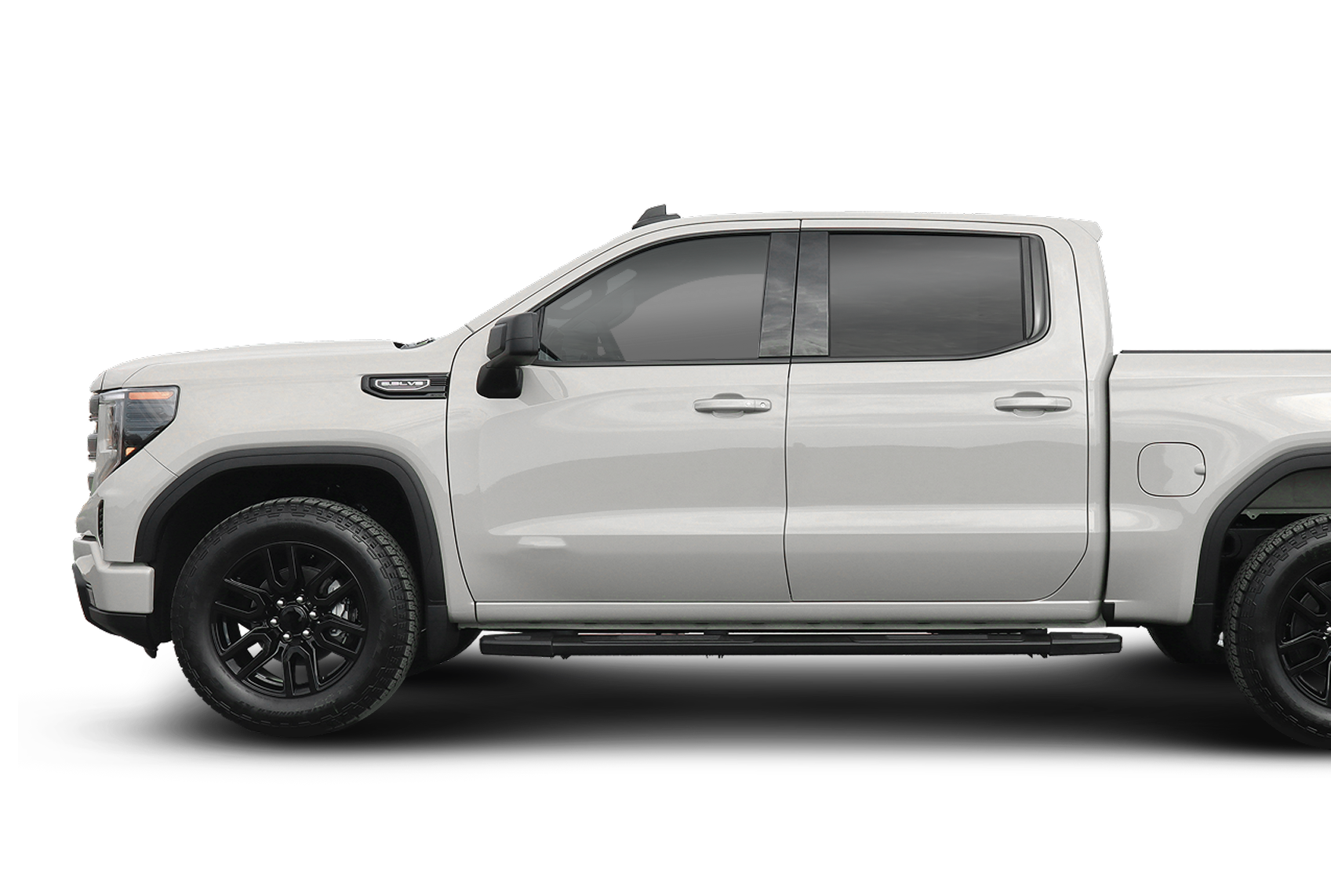 White pickup truck with black wheels. Side view. | Good Guys Auto Care & Tires