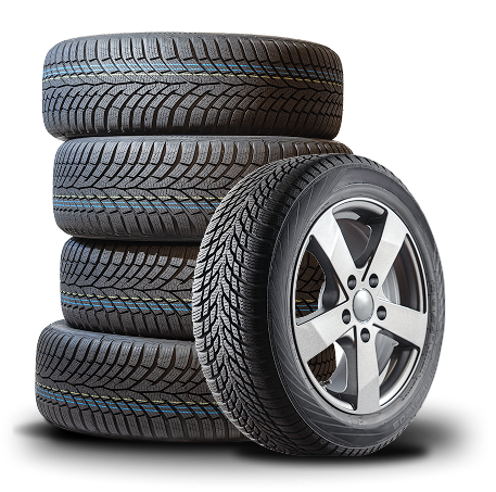Pile of black car tires, one mounted on a silver rim. | Good Guys Auto Care & Tires