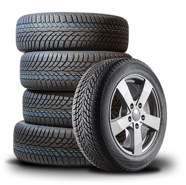Pile of black car tires, one mounted on a silver rim. | Good Guys Auto Care & Tires