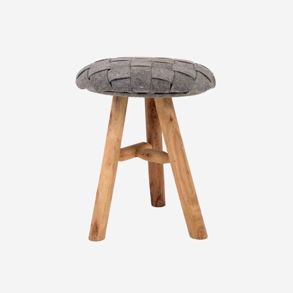 Gray upholstered stool with three wooden legs on a white background