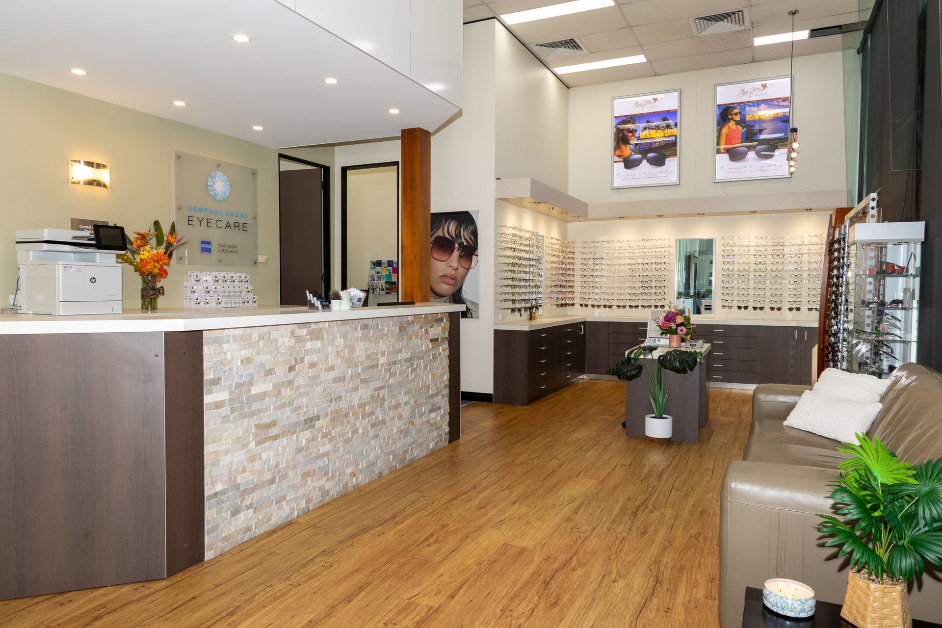 A Reception Area Of An Optical Shop With A Couch And A Counter — Central Coast Eyecare In Gosford, NSW