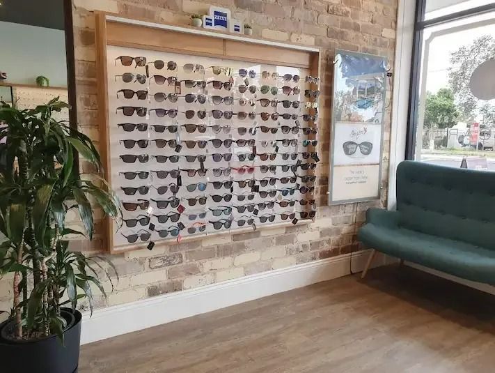 A Lot Of Sunglasses On The Wall In Optical Shop — Central Coast Eyecare In Budgewoi, NSW