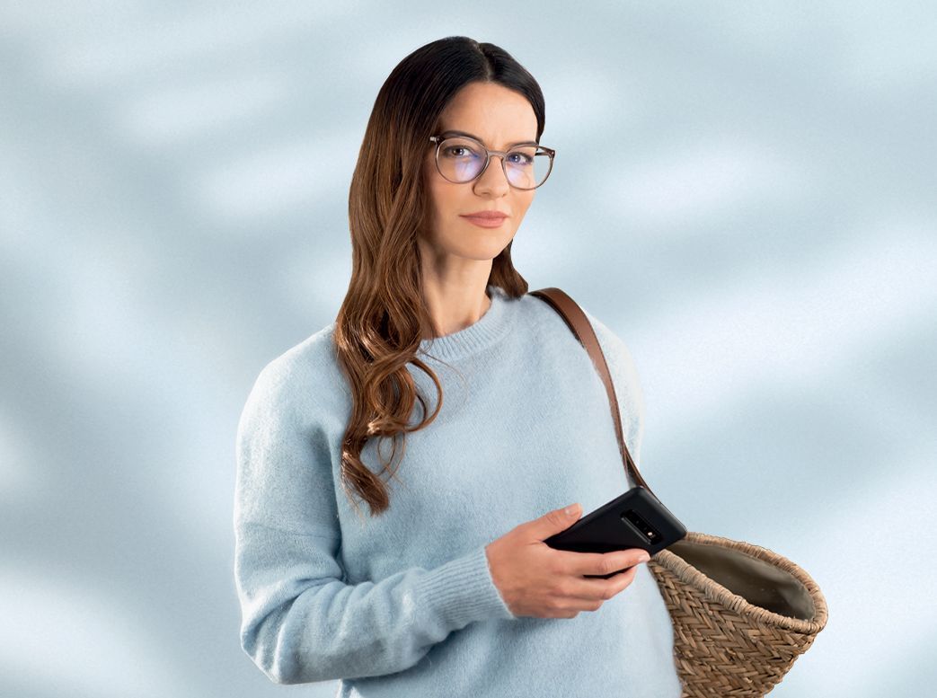 Woman Wearing Glasses While Smiling — Central Coast Eyecare In Gosford, NSW