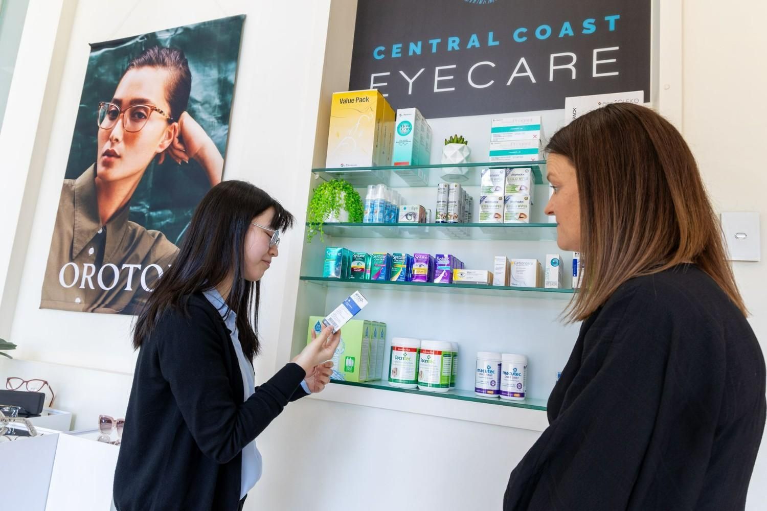 Optometrist and patient on eyecare products — Optometrist in Gosford, NSW