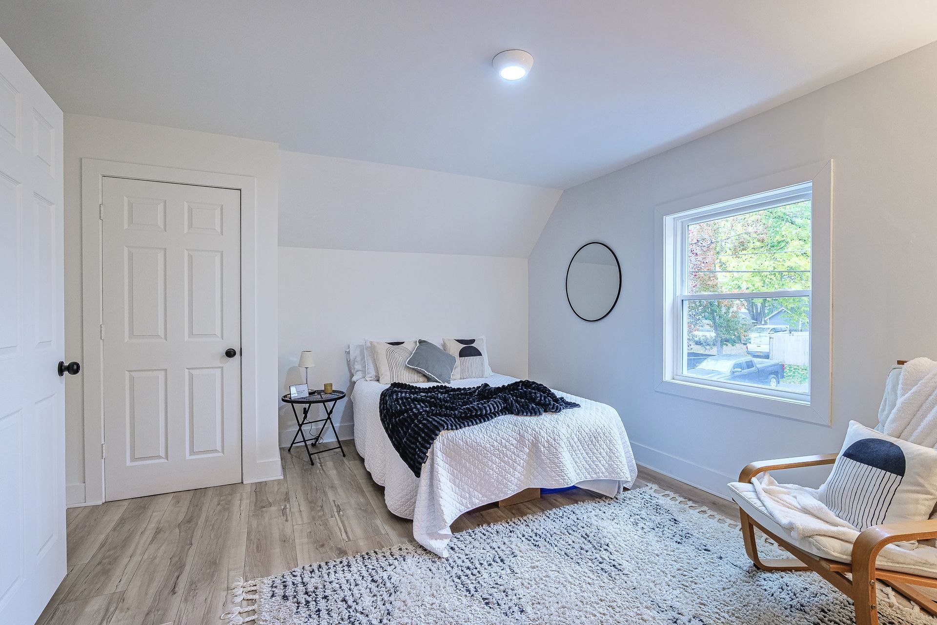 A kitchen with a large wooden table and chairs