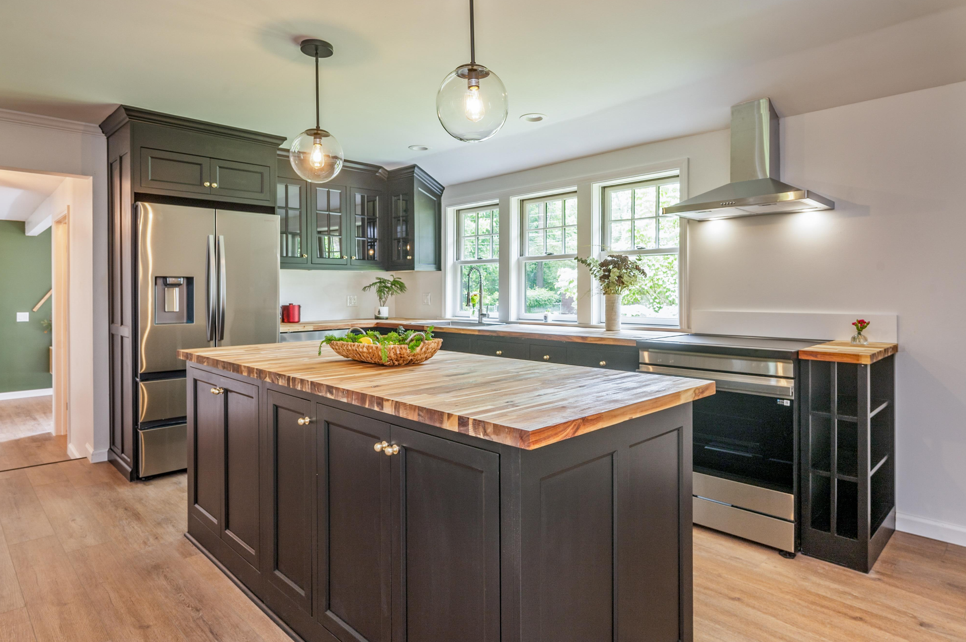 A living room with a couch , chair , coffee table and rug.