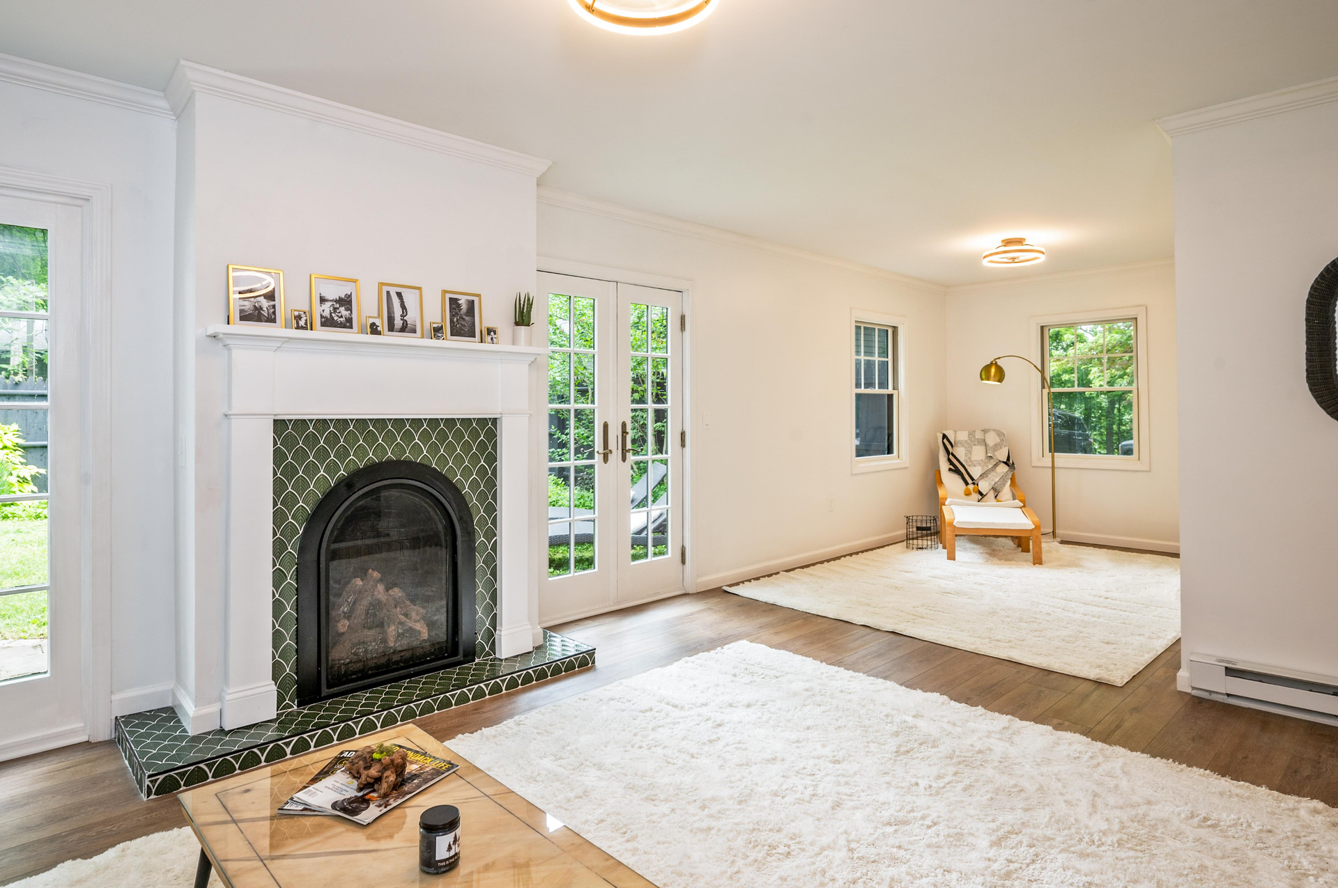 A living room with a fireplace and a coffee table