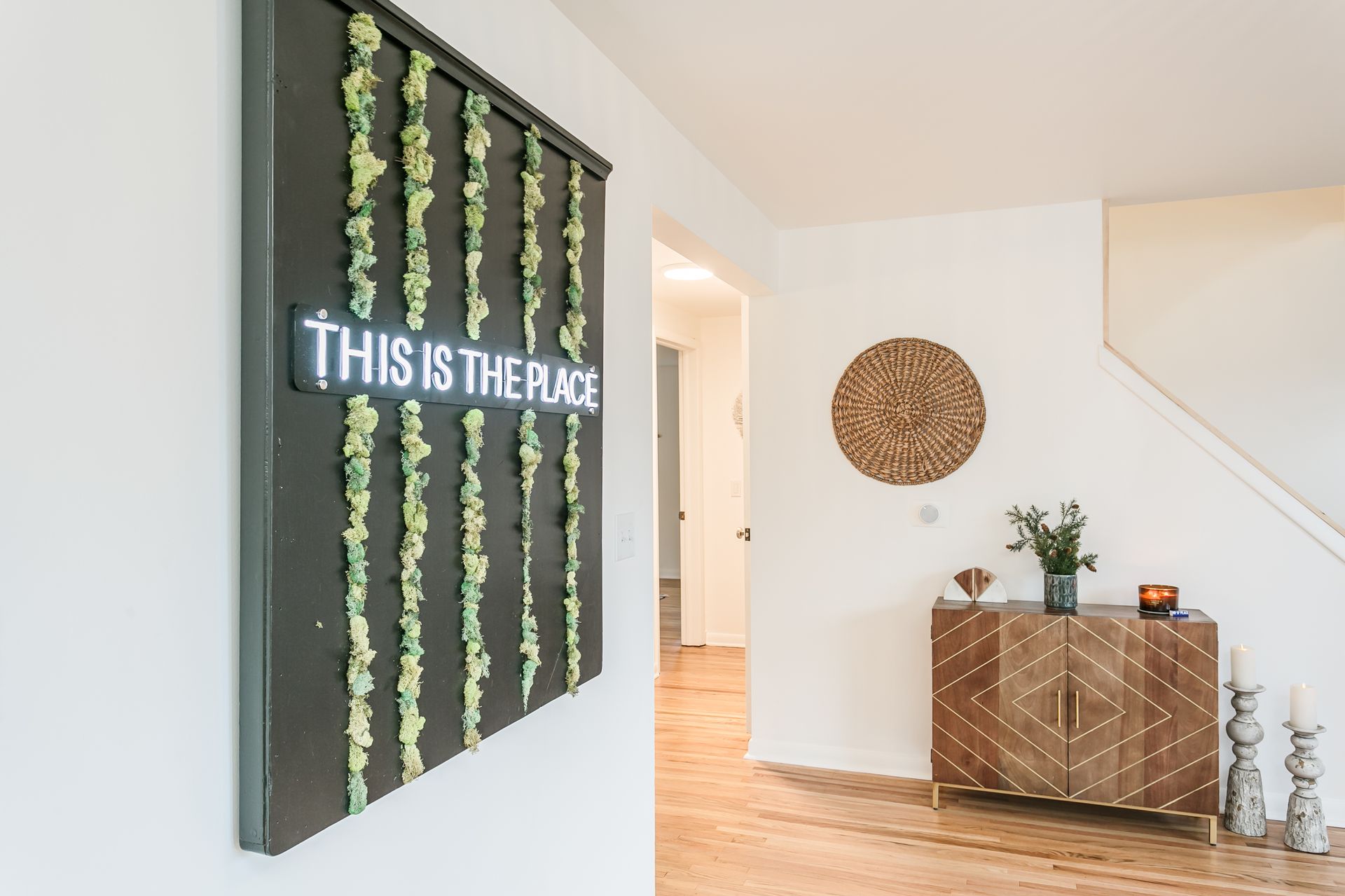 A sign on a wall that says `` this is the place ''