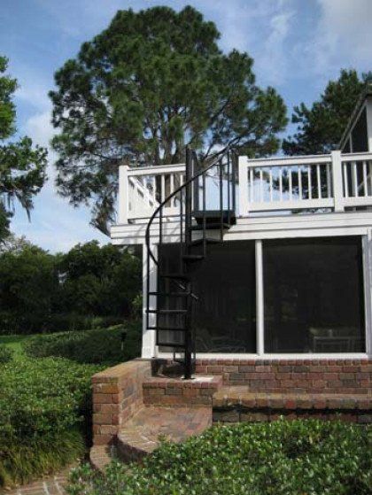 A house with a spiral staircase on top of it