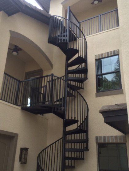 A spiral staircase in the middle of a building