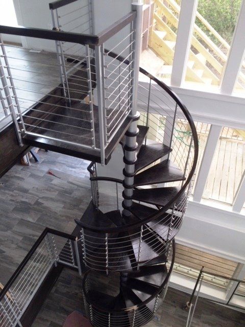 An aerial view of a spiral staircase in a house