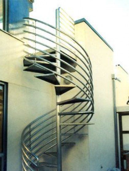 A spiral staircase on the side of a building