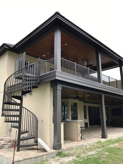 A house with a spiral staircase on the side of it