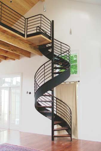There is a spiral staircase in the middle of the room.