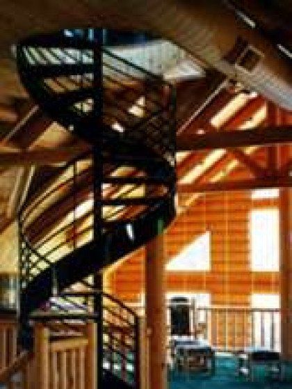 There is a spiral staircase in the middle of the room.