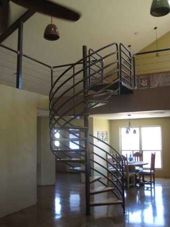 A spiral staircase leading to the second floor of a house
